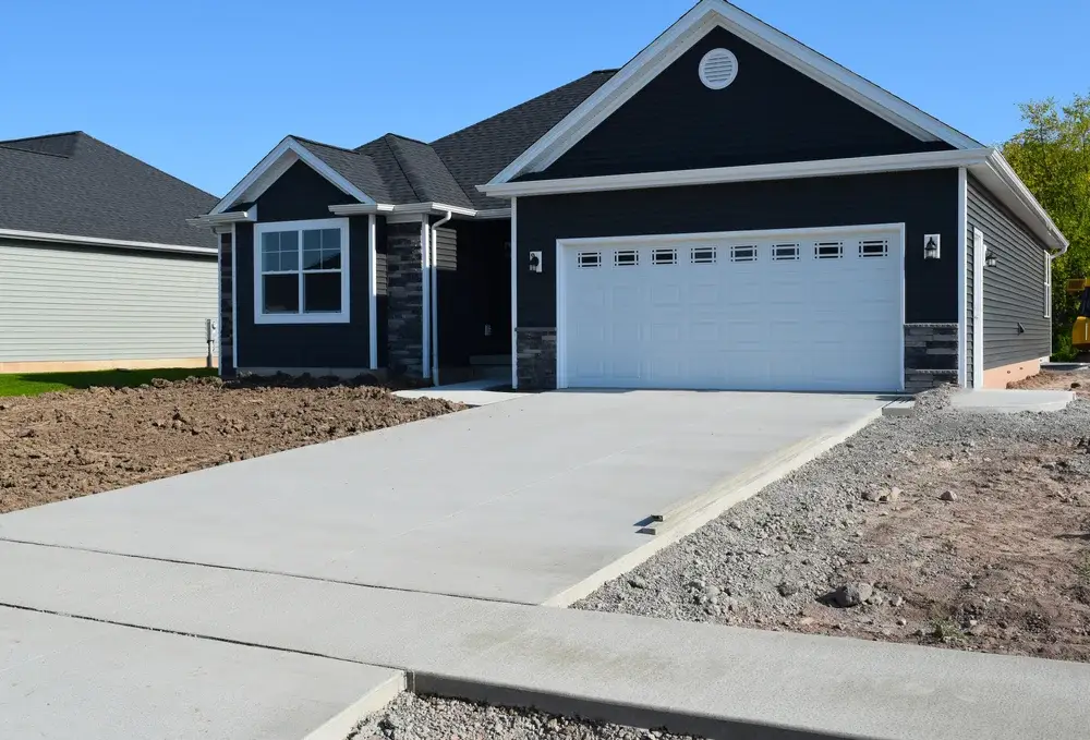 New Home Driveway Construction with a Concrete Cement Foundation by Builders for a Smooth Surface