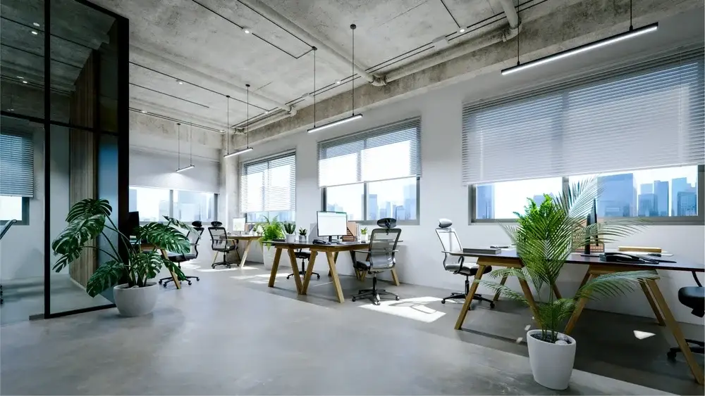 Modern office interior with exposed concrete ceiling and floor.