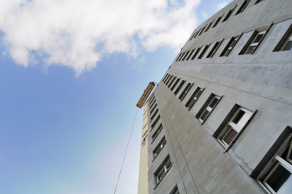 sky view of concrete building with blue sky