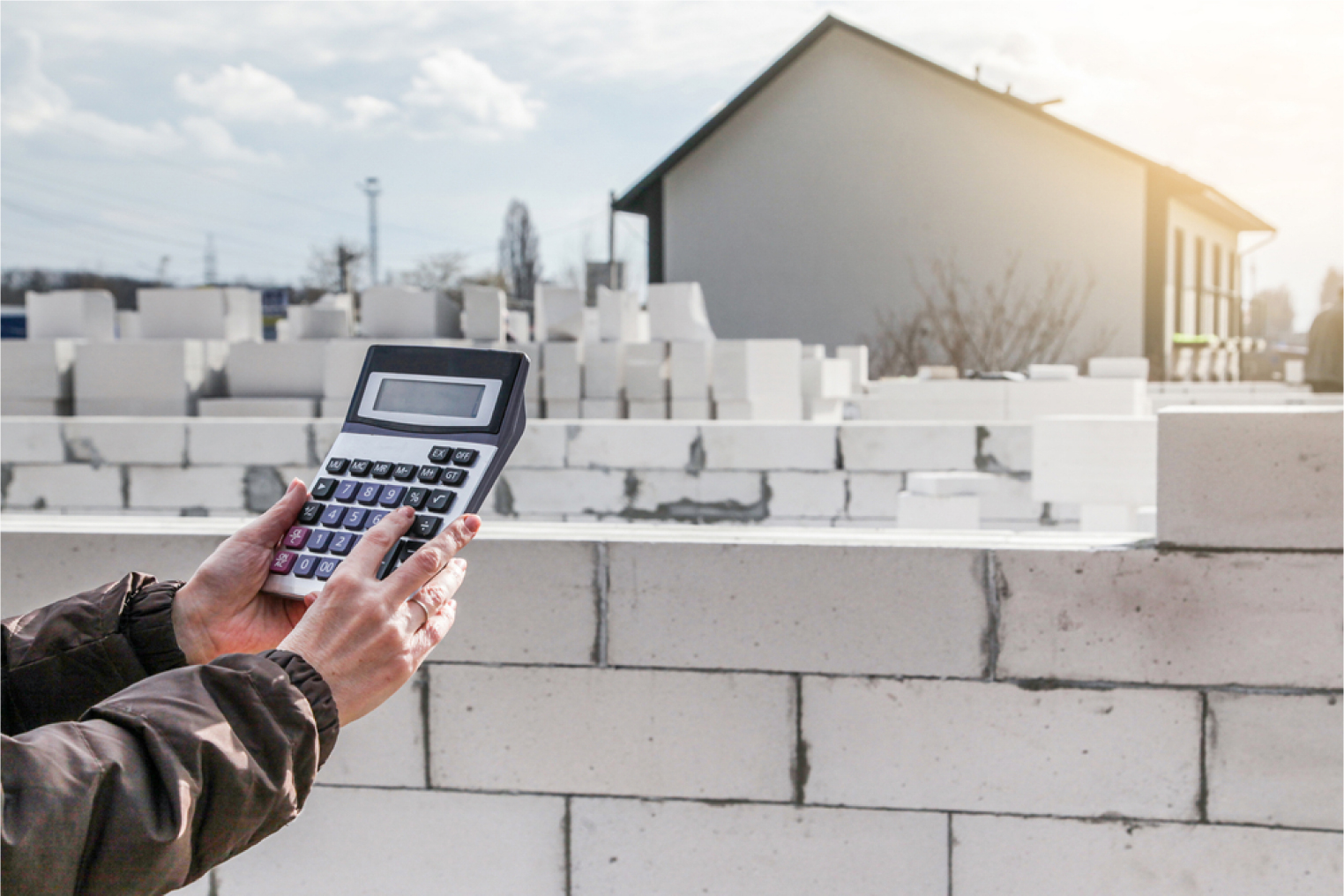 Calculation of building materials. Calculates cost of building a house. Calculator on background of aerated concrete.