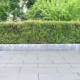 Garden, beautifully trimmed shrubs gray tile floor Multipurpose yard Suitable for a walk or picnic.